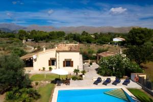 an aerial view of a house and a swimming pool at Villa L´Embat in Pollença
