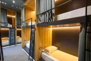 a room with several bunk beds in it at Grand Hostel Berat in Berat