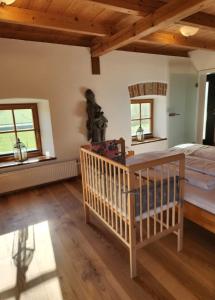 a bedroom with a bed and a wooden ceiling at Ferienwohnung Polsing 19 in Palling