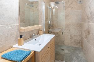 a bathroom with a sink and a shower at Rose Antique in Valréas +18 photos