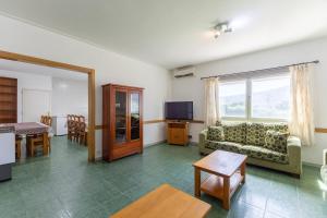 a living room with a couch and a table at La Nave de Gredos in Burgohondo