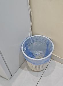 a blue basket sitting next to a wall at عمارة دار الضيافة in Medina