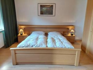 a bedroom with a bed with two pillows on it at Ferienwohnung Sonnenschein in Tülau