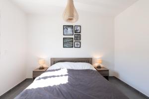 a bedroom with a bed and two night stands at Residence Cismonte in Morosaglia