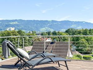 a couple of chairs sitting on top of a deck at Pfänderblick in Lindau