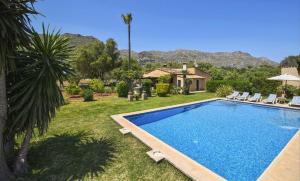a swimming pool in the yard of a house at Tonina in Pollença
