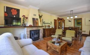 a living room with a couch and a fireplace at Tonina in Pollença