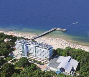 an aerial view of a hotel on a beach at Sanatorium Uzdrowiskowe Bałtyk in Kołobrzeg