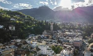 a view of a city with a clock tower at Residence Hubertus Ap 1 - Meran in Merano