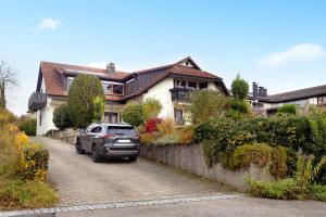 a car parked in front of a house at Reif Markelfingen in Radolfzell am Bodensee