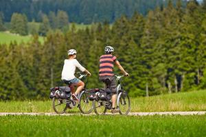 two people riding bikes on a dirt road at Unterer Gurethshof in Zell am Harmersbach