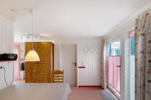 a kitchen with a table and a dining room at Möve Aba Bungalow 62 in Rerik