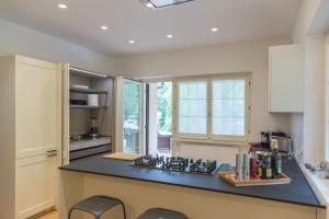 a kitchen with a counter and a stove top oven at Villa Minerva in Lazise