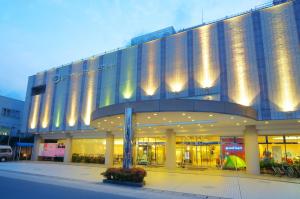 a large building with lights on the side of it at New Royal Hotel Shimanto in Shimanto