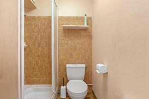 a bathroom with a toilet and a shower at Le Mas Berliat studio N° 10 in Bormes-les-Mimosas