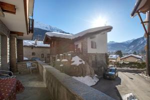 a house with a car parked in front of it at Courmayeur 3V21 in Courmayeur