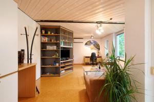 a living room with a table and a couch at Stumpp´s Appartement in Heroldstatt