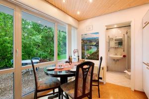 a dining room with a table and chairs at Stumpp´s Appartement in Heroldstatt +9 photos