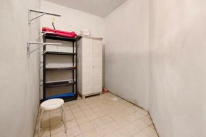 a small room with a shelf and a stool at Plain Soleil ski home in Prato Nevoso