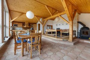 a kitchen and living room with a wooden ceiling at Ferienwohnungen Kämpenberg in Dingen