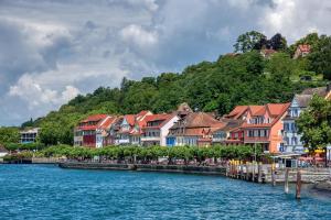 a group of houses on the side of a river at Ferienhof Dreher in Meersburg