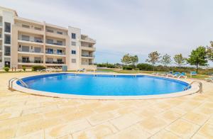a large swimming pool in front of a building at Penthouse Monte da Eira - Sunset in Albufeira