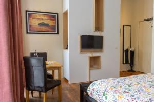 Телевізор і / або розважальний центр в tam tam city lodge