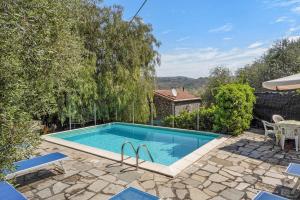 a swimming pool in the backyard of a house at Casa Paola e del Poeta in Costa Carnara