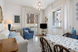 a living room with a bed and a dining room at Zaffiro Apartment With Garage in Rapallo