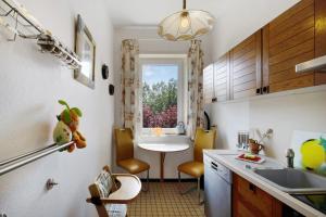 a kitchen with a sink and a table and a window at Der Falkenhorst in Bad Sachsa +12 photos