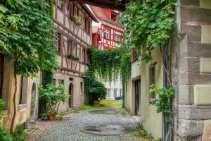 an alleyway in an old town with buildings at Ferienhof Dreher in Meersburg +9 photos