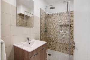 a bathroom with a sink and a shower at Pear Tree Villa in Vale do Lobo +17 photos