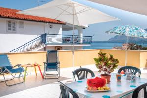 a table with a slice of cake on top of a balcony at Casa Viola - a 100 metri dal mare in Trappeto