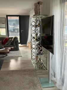 a living room with a tv on a stand at Villa julia in Cros