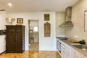 a kitchen with a sink and a counter at Bosque Apartamento in Girona
