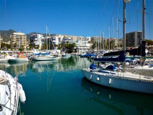 a group of boats docked in a harbor at Modern Apartment next the Beach in Marbella