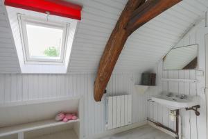 a bathroom with a sink and a window at Ker Ar Vro - Maison atypique in Locquirec +23 photos