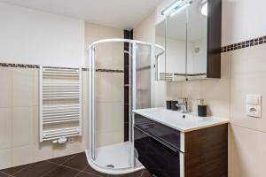 a bathroom with a sink and a shower at Bergschatz in Wildschönau
