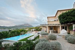 an exterior view of a house with a swimming pool at Villa Oasis Del Mar in El Toro