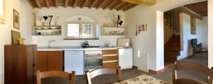 a kitchen with a sink and a counter top at La Casa Rossa 2 in Bibbona