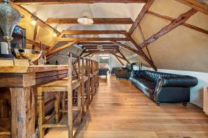 a tasting room with a bar and leather seats at Wohlfühlurlaub in der Scheune in Ochsensaal