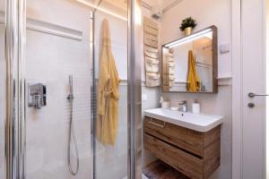 a bathroom with a sink and a shower at Summer and Winter in Perledo +26 photos