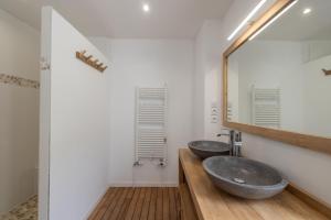 two sinks in a bathroom with a mirror at Chalet La Llyre Vallorcine in Vallorcine +20 photos