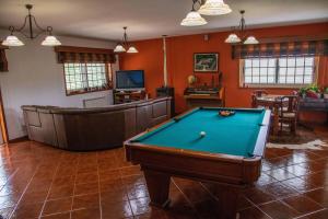a living room with a pool table in it at Recanto Transmontano in Macedo de Cavaleiros