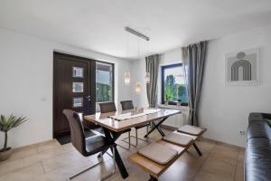 a dining room with a table and chairs at Ferienwohnung Mayer in Albstadt