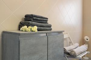 a pile of towels sitting on a table in a bathroom at Giaely in Borghetto Santo Spirito +37 photos