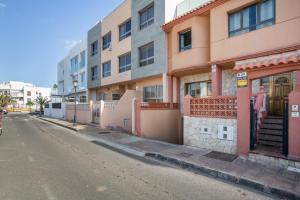 an empty street in front of a building at Corralejo Ian’s Dreams in Corralejo