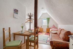 a living room with a couch and a table at Ferienwohnung Sila 3 in Weinstadt