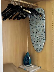 a mirror hanging on a wall in a closet at Apartments San Biagio in Vicenza