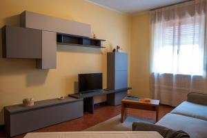 a living room with a couch and a tv at Casa vacanza Semia in Vinadio